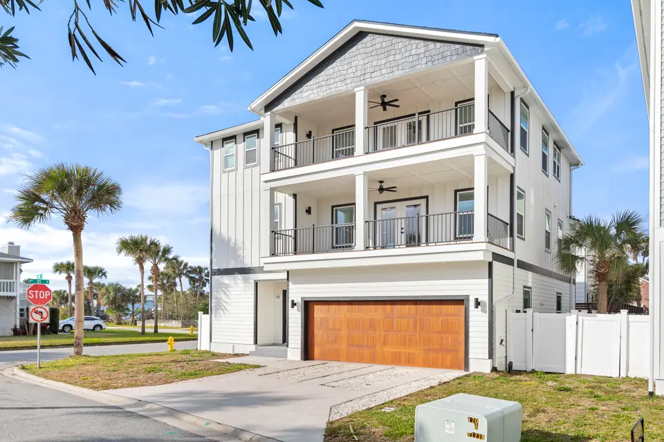 A view of South Jacksonville Beach New Construction, Dark Blue Statement Home, designed by Zen Reno & Design in Jacksonville Beach, FL